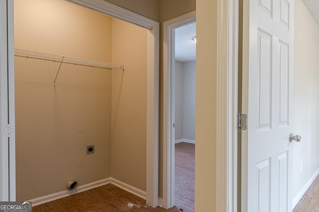 laundry area with electric dryer hookup and wood-type flooring