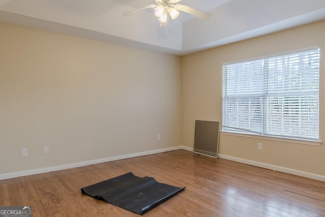 unfurnished room with ceiling fan and wood-type flooring