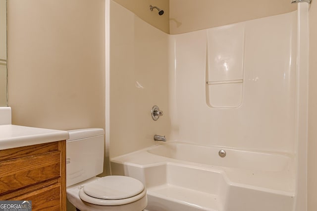 full bathroom featuring shower / bath combination, vanity, and toilet