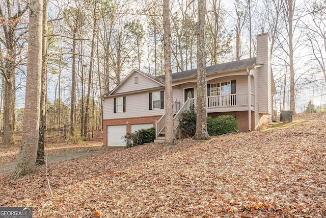 view of front of property featuring a garage and covered porch