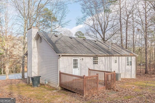 back of house featuring a deck