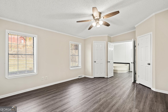 unfurnished bedroom featuring a textured ceiling, ceiling fan, crown molding, and dark hardwood / wood-style floors