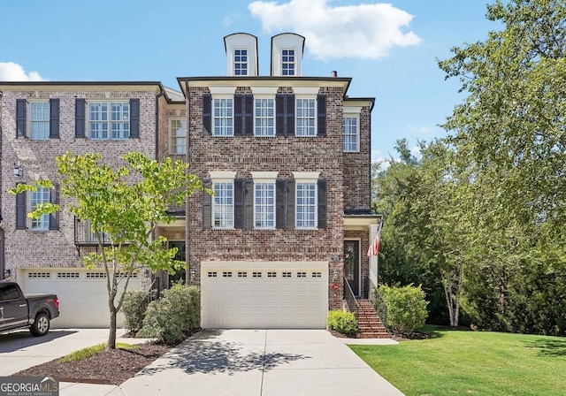 view of front of home with a front lawn and a garage