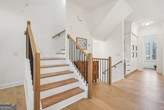 475 Rose Garden Ln, Alpharetta, GA 30009 - staircase featuring crown molding and wood finished floors