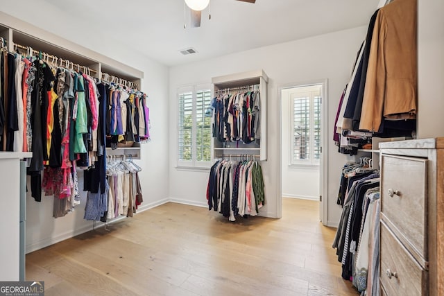 475 Rose Garden Ln, Alpharetta, GA 30009 - spacious closet with a ceiling fan and light wood-style flooring