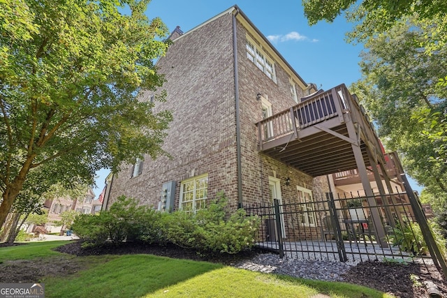 475 Rose Garden Ln, Alpharetta, GA 30009 - view of property exterior featuring brick siding, a deck, and a patio