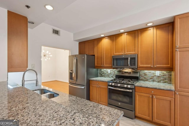 50 Biscayne Dr Unit 2109, Atlanta, GA 30309 - kitchen with stainless steel appliances, a sink, light stone counters, and recessed lighting