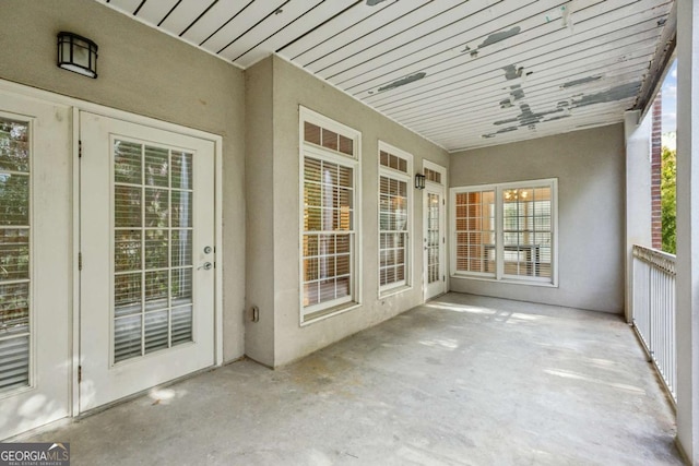 unfurnished sunroom featuring a healthy amount of sunlight