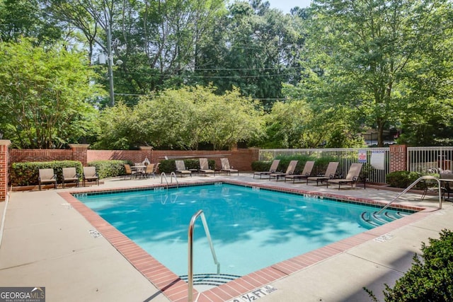 view of swimming pool featuring a patio