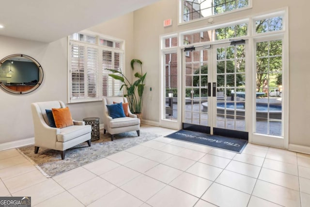 50 Biscayne Dr Unit 2109, Atlanta, GA 30309 - doorway to outside featuring baseboards, tile patterned flooring, and french doors