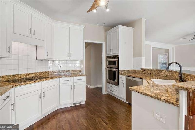 kitchen featuring sink, ceiling fan, light stone counters, white cabinetry, and stainless steel appliances