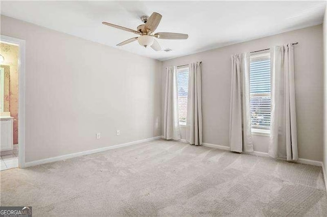 empty room with light carpet and ceiling fan