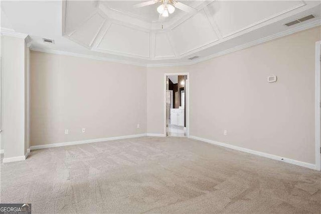 unfurnished room featuring light carpet, ornamental molding, ceiling fan, and coffered ceiling