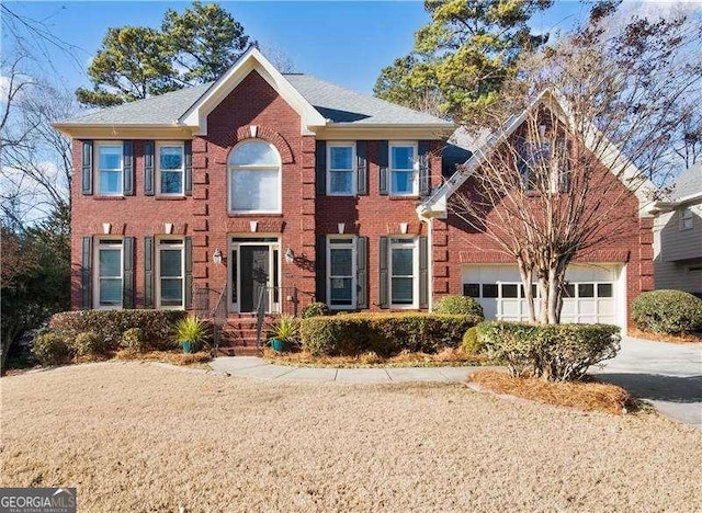 colonial home with a garage