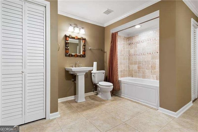 full bathroom featuring shower / tub combo, tile patterned floors, ornamental molding, sink, and toilet