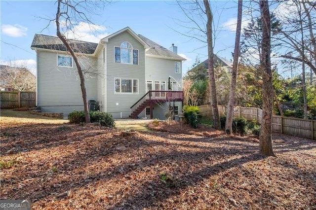 back of house featuring a deck