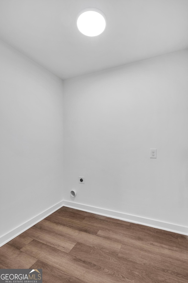 unfurnished room with wood-type flooring