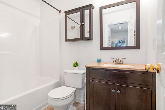 bathroom featuring shower / washtub combination, vanity, toilet, and baseboards