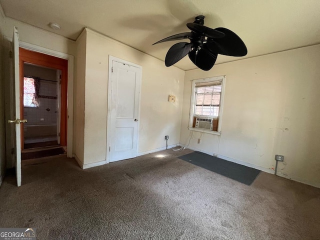 unfurnished bedroom with carpet flooring, ceiling fan, and cooling unit