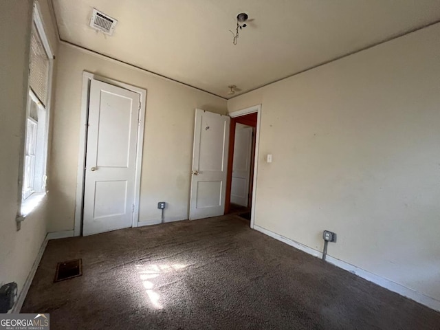 unfurnished bedroom featuring carpet flooring