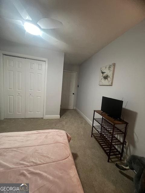 bedroom with carpet floors and a closet