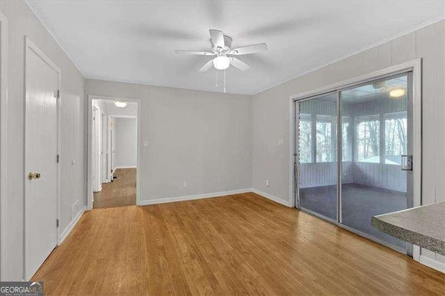 spare room featuring ceiling fan and wood-type flooring