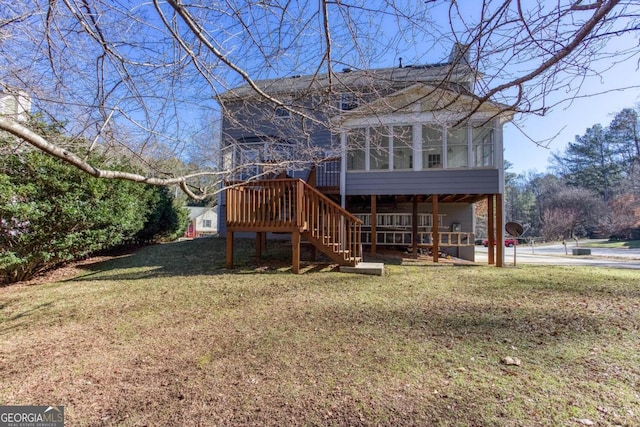 back of property with a sunroom and a lawn