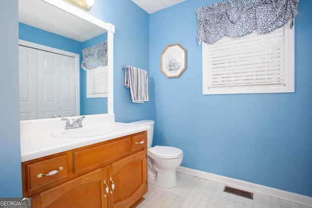 bathroom with vanity and toilet