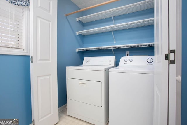 laundry area featuring washing machine and clothes dryer