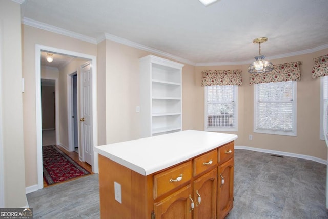 kitchen featuring hanging light fixtures, crown molding, and a center island