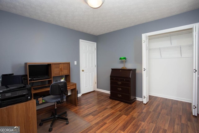 office space with dark wood-type flooring and a textured ceiling