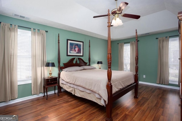 bedroom featuring ceiling fan, dark hardwood / wood-style floors, and vaulted ceiling