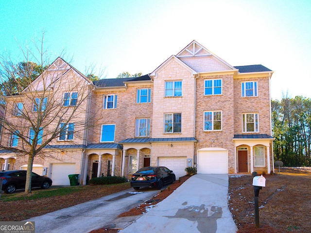 multi unit property featuring a garage