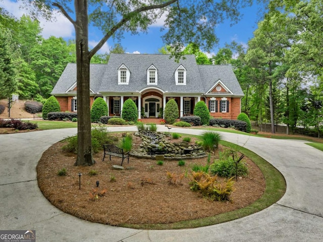 cape cod house with a porch