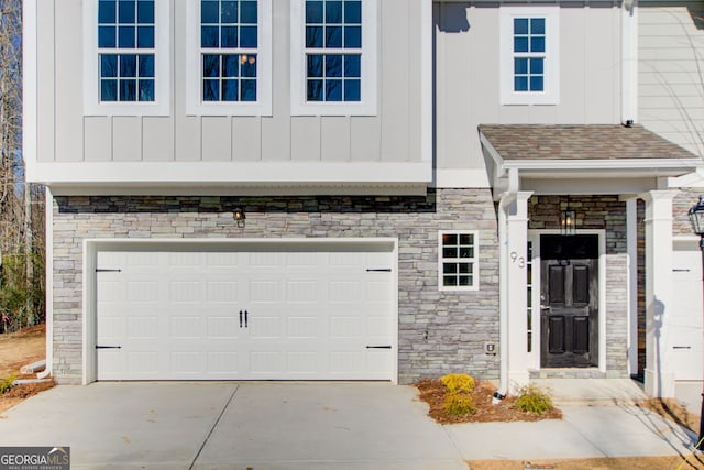 doorway to property featuring a garage