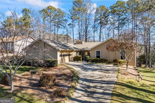 ranch-style house featuring a garage