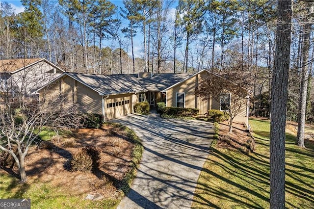 ranch-style home featuring a garage