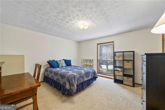 bedroom with carpet floors and a textured ceiling