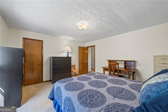 carpeted bedroom featuring a textured ceiling