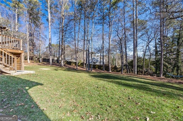 view of yard featuring a wooden deck