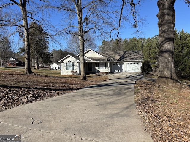 ranch-style house featuring a garage