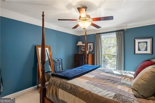 bedroom featuring carpet, ceiling fan, and crown molding