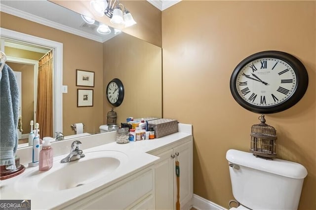 bathroom with crown molding, vanity, a notable chandelier, and toilet