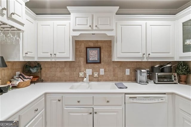 kitchen with white cabinets, dishwasher, sink, and backsplash