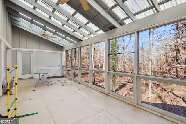 unfurnished sunroom featuring vaulted ceiling and ceiling fan