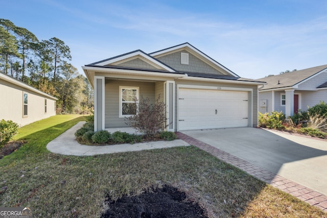 ranch-style home with a garage and a front lawn