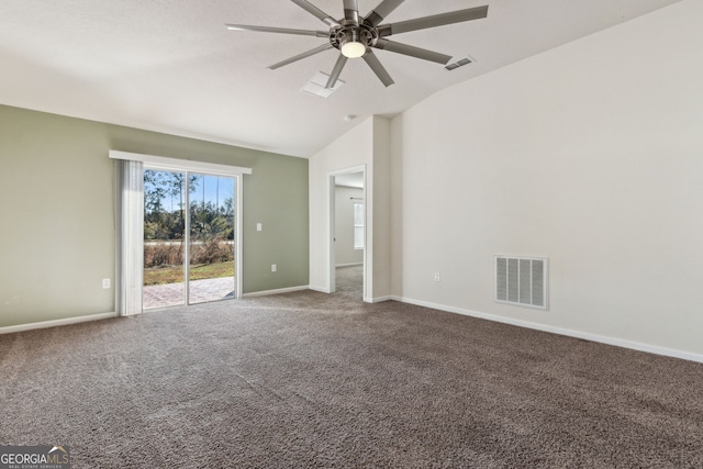 carpeted spare room featuring vaulted ceiling and ceiling fan