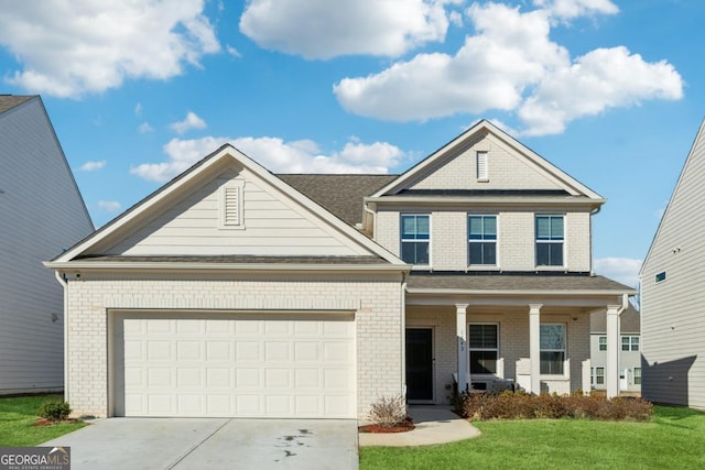 view of front of home with covered porch, a garage, and a front lawn