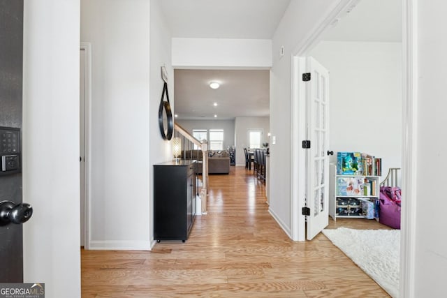 corridor featuring light hardwood / wood-style flooring