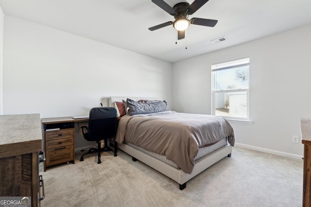 bedroom with ceiling fan and light colored carpet